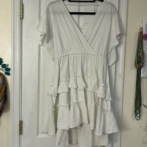 White flutter sleeve dress, low front and low back, tie waist